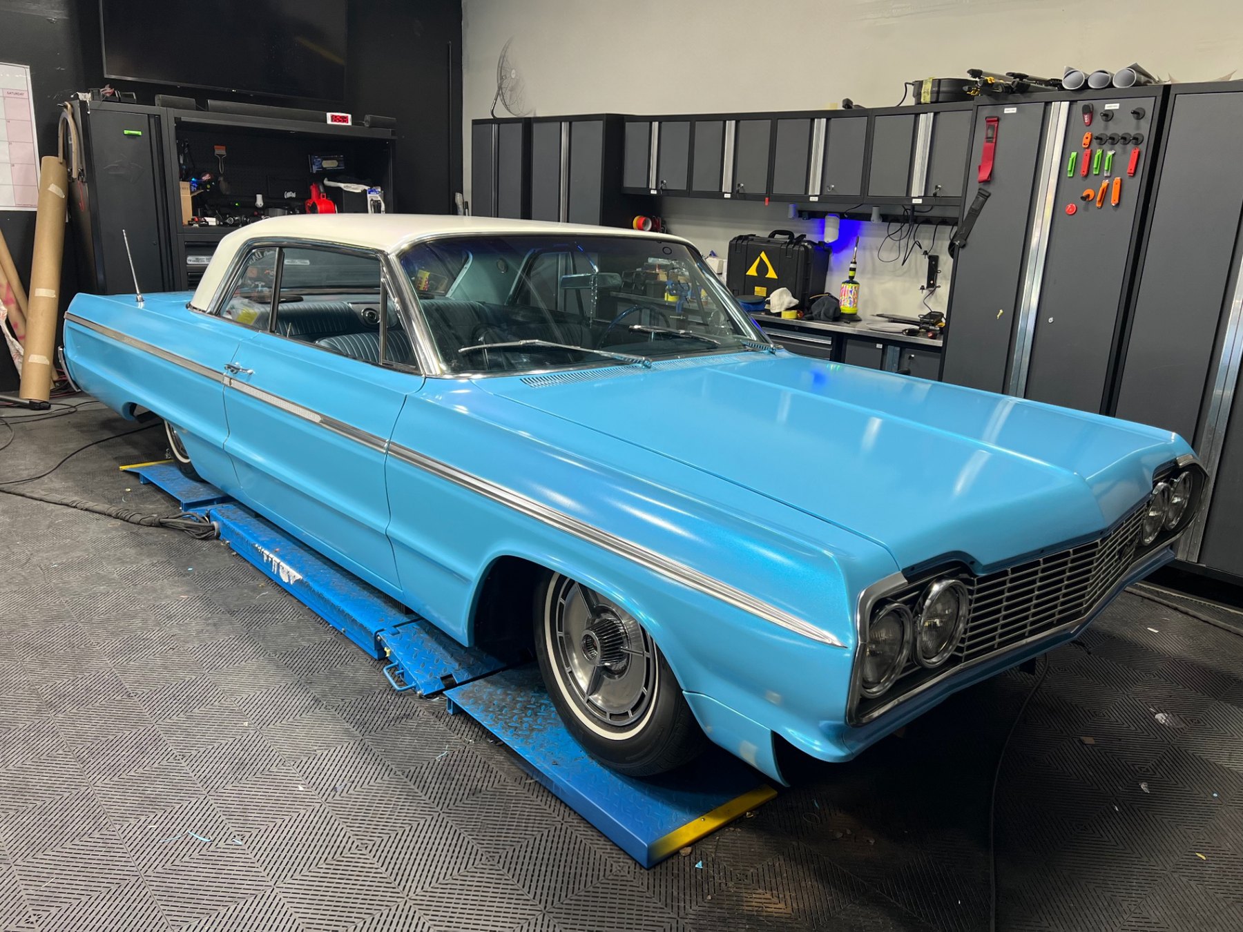 Completed metallic blue vinyl wrap on a classic coupe