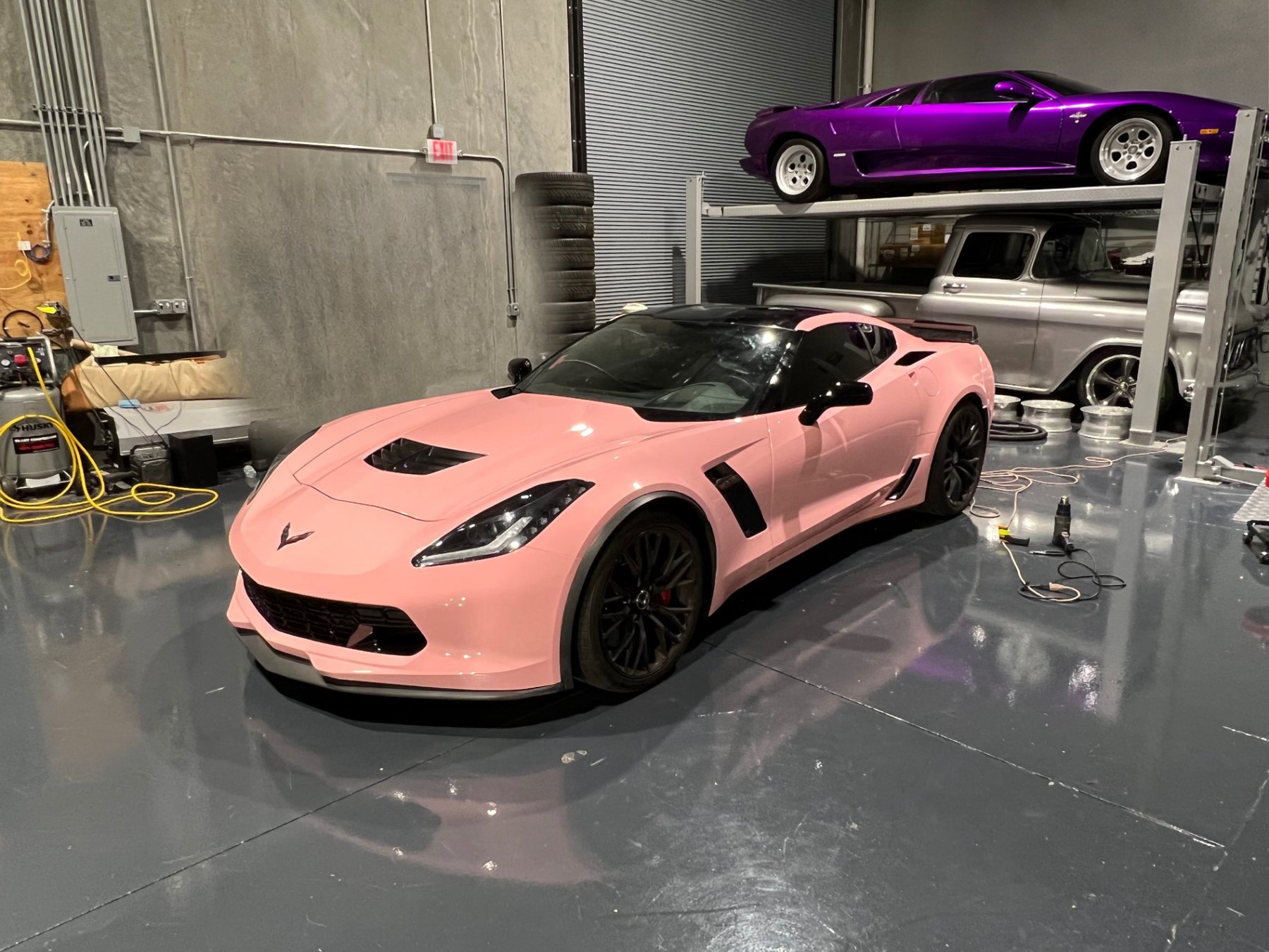 Completed gloss pink vinyl wrap on a Corvette