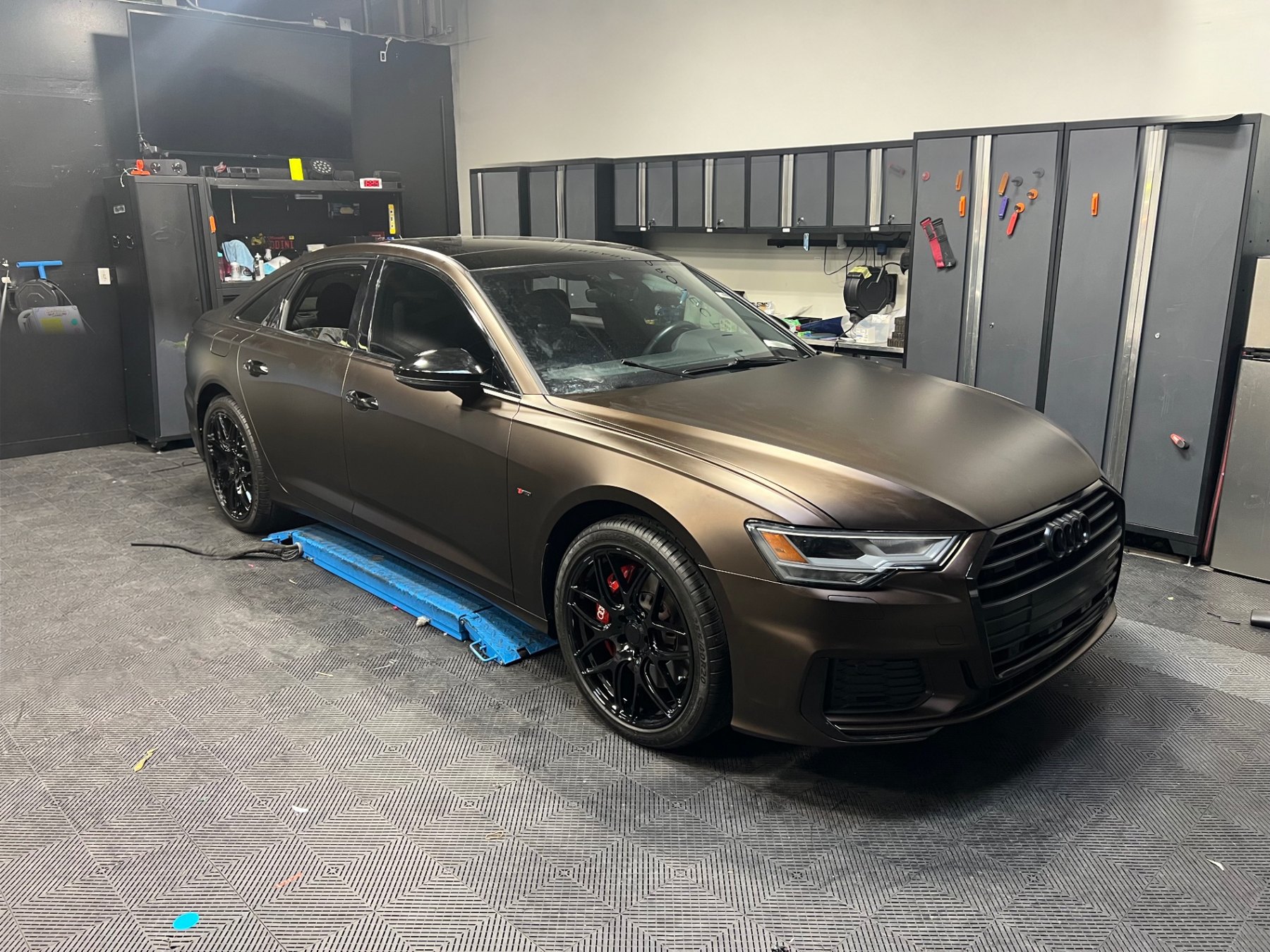 Completed satin bronze vinyl wrap on an Audi sedan